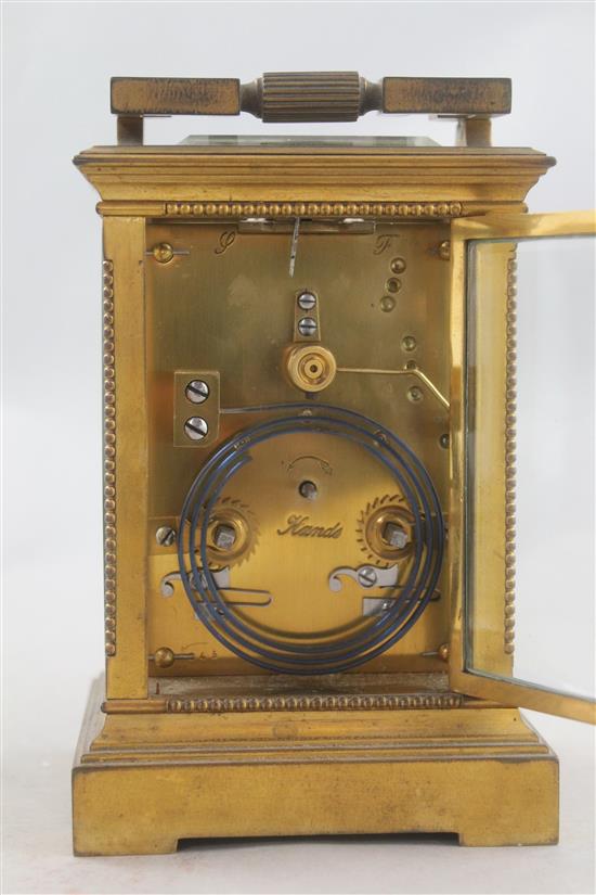 An early 20th century French gilt brass hour repeating carriage clock, 6.5in.